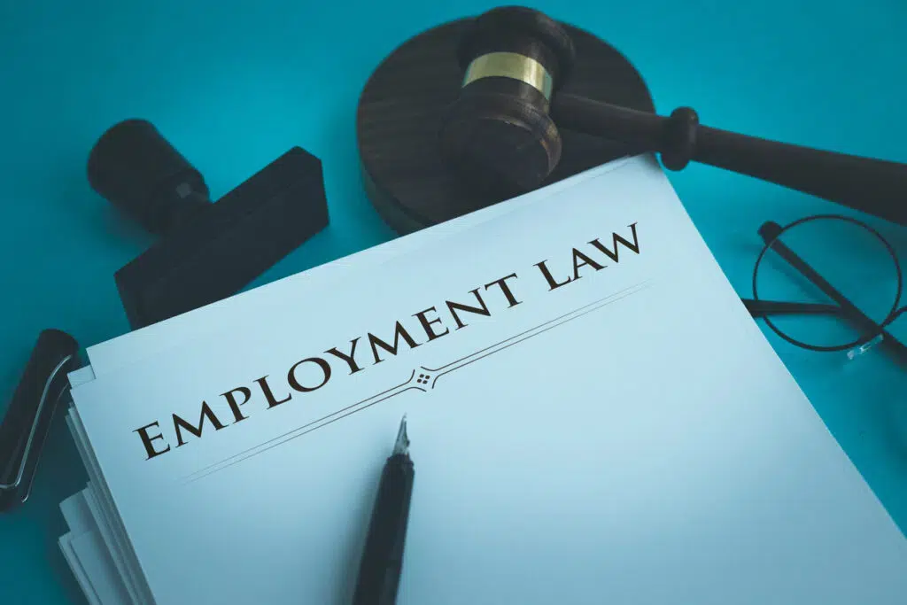 employment law documents on top of a table next to a gavel