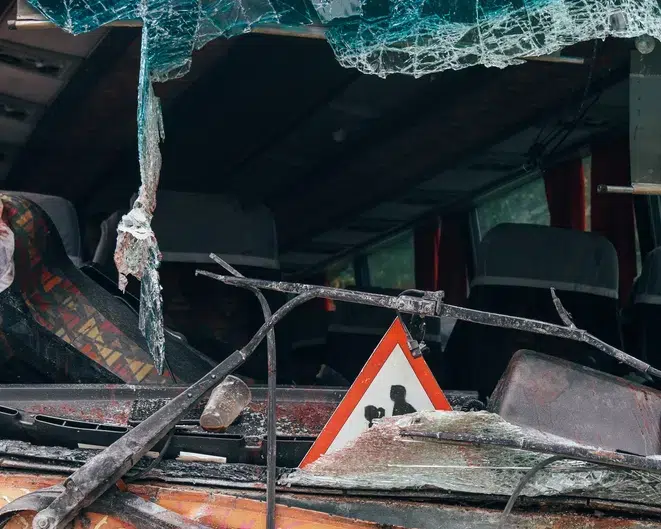 bus involved in an accident window screen totally damaged