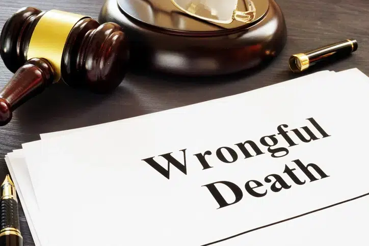 wrongful death claim documents with gavel on the table